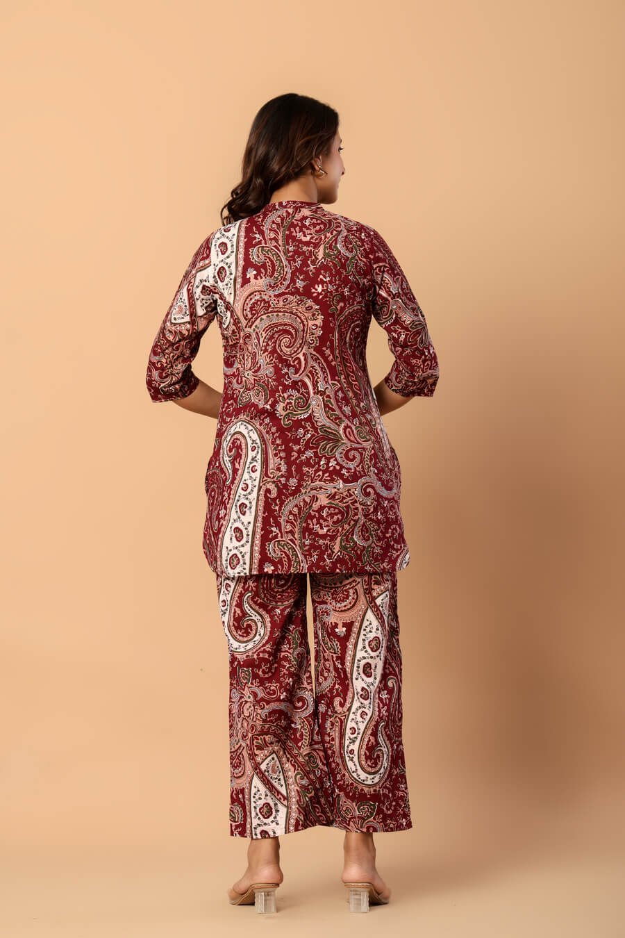Woman wearing a maroon and ivory paisley print cotton tunic and matching straight pants — image 3
