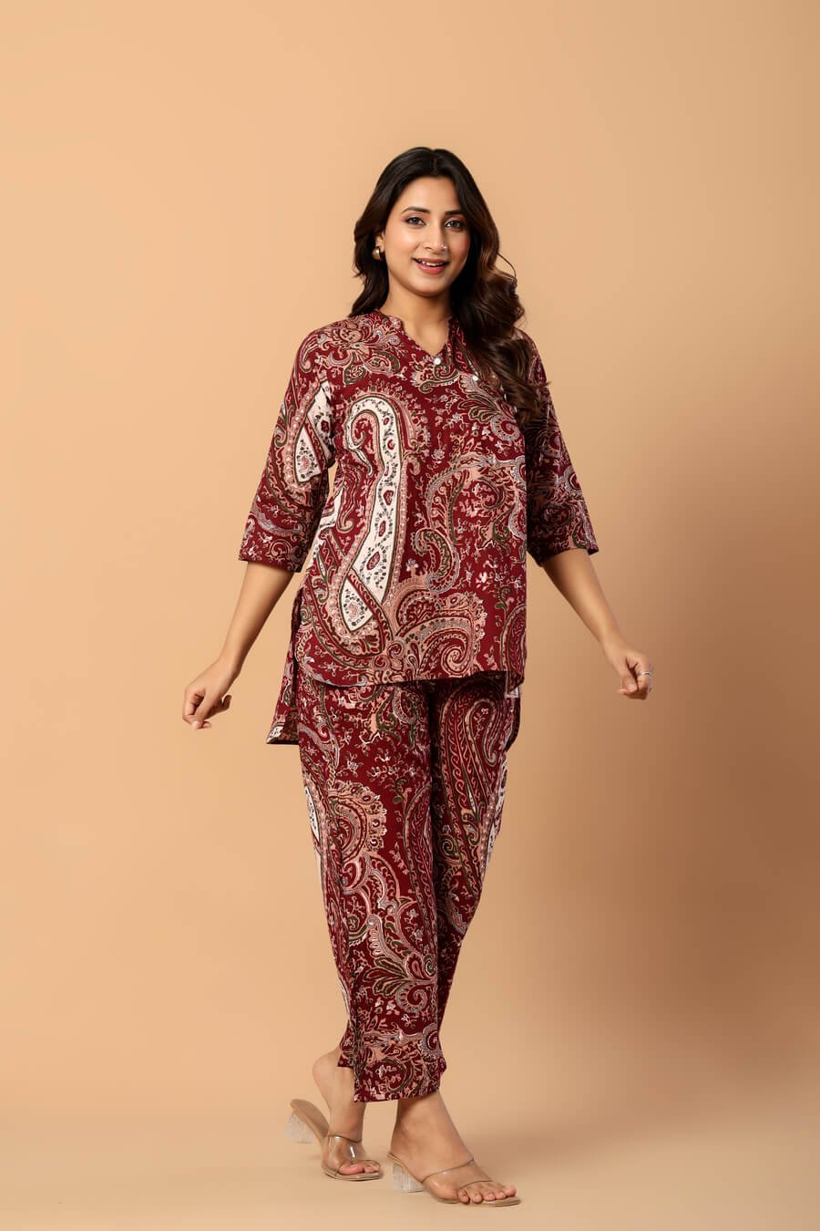 Woman wearing a maroon and ivory paisley print cotton tunic and matching straight pants — image 5