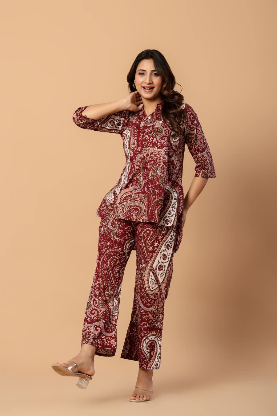 Woman wearing a maroon and ivory paisley print cotton tunic and matching straight pants — image 6