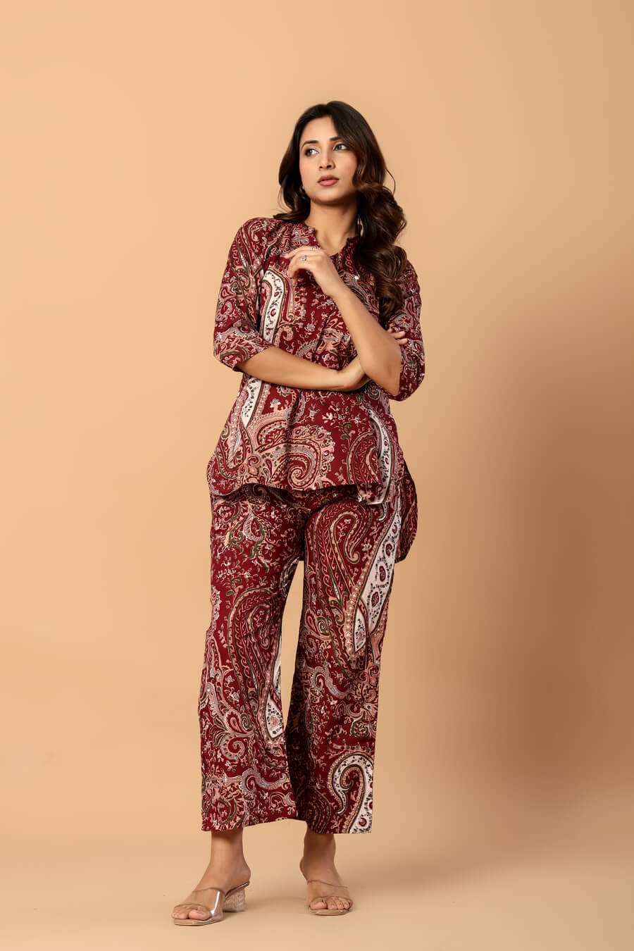Woman wearing a maroon and ivory paisley print cotton tunic and matching straight pants — image 7
