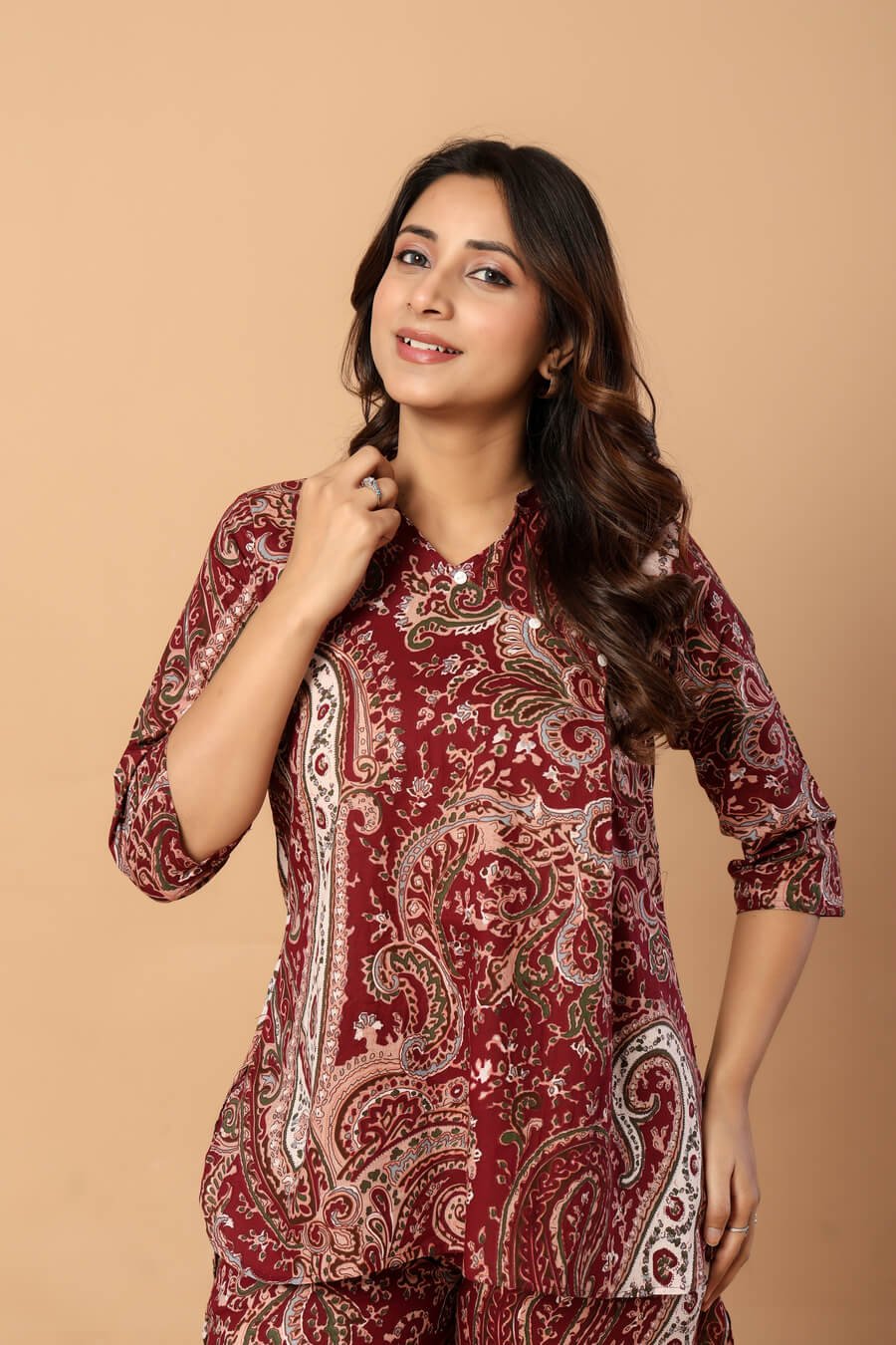 Woman wearing a maroon and ivory paisley print cotton tunic and matching straight pants — image 8